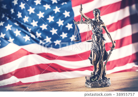 Lady Justice and American flag. 38955757