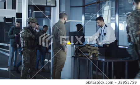 Airport security apprehending a suspect Airport security apprehending a suspect 38955759