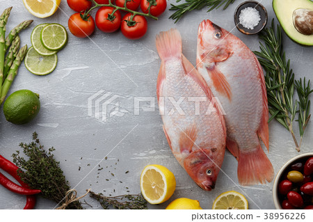 Raw red tilapia fish cooking 38956226