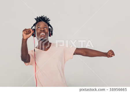 African American man in headphones listening to African American man in headphones listening to 38956665
