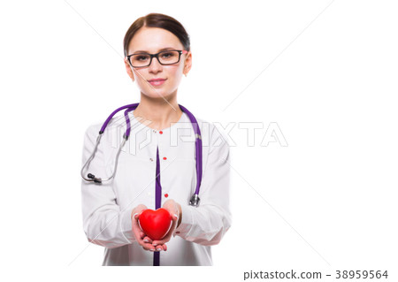 Young beautiful female doctor holding heart in her 38959564