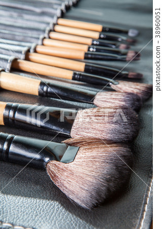 Set of  makeup brushes in row black leather cover  38960051
