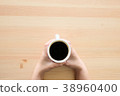 Cup of hot coffee amaricano on the wooden 38960400