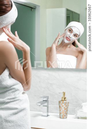 woman with a mask on her face 38962667
