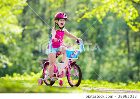 Child riding bike. Kid on bicycle. 38963018