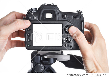 Hands photographer adjust SLR camera isolated Hands photographer adjust SLR camera isolated 38963144