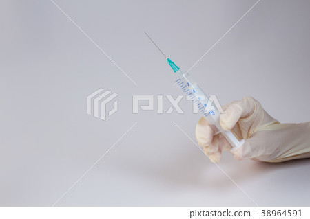 Syringe in the hand 38964591