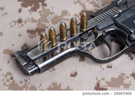 Beretta hand gun on desert marines uniform Beretta hand gun on desert marines uniform 38965906