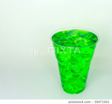 glass of sweet water with ice cubes on white glass of sweet water with ice cubes on white 38971002