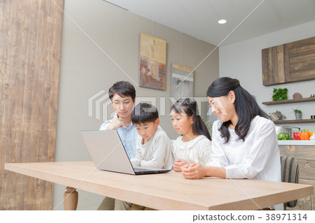 Family using a personal computer Father Dad Mother Mother Sister study 38971314