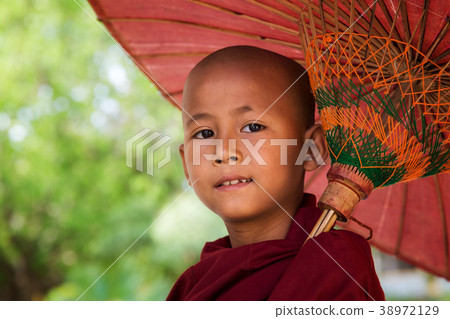 Face of myanmar monk with umbrella Face of myanmar monk with umbrella 38972129