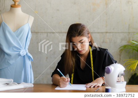 Fashion designer working for freelance 38972752