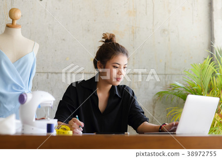 Fashion designer working for freelance Fashion designer working for freelance 38972755