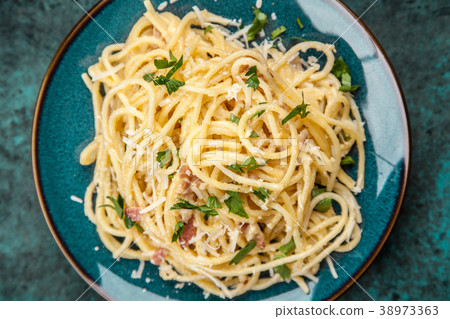 Spaghetti carbonara with egg and pancetta Spaghetti carbonara with egg and pancetta 38973363