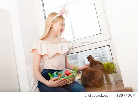 Teenage girl holding Easter eggs 38974007