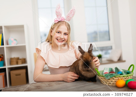 Teenage girl holding Easter eggs 38974027