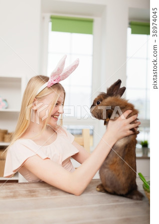 Teenage girl holding Easter eggs Teenage girl holding Easter eggs 38974045