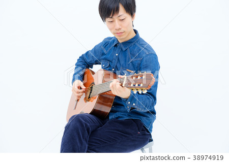 Men playing classical guitar 38974919