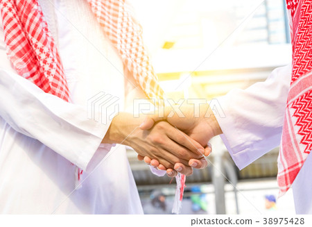 Arab emirates businessman shaking hands  38975428