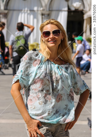 Pretty woman with long blond hair in Venice, Italy 38976006