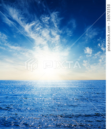 dark blue sea and sky with clouds in sunset 38978358