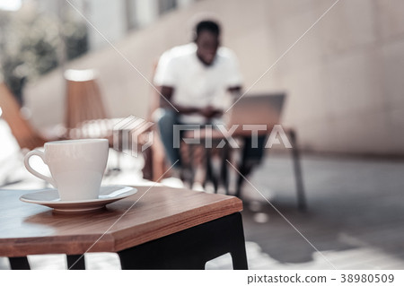 African american man working on laptop in local African american man working on laptop in local 38980509