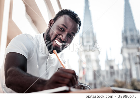 Radiant african american writing something down Radiant african american writing something down 38980573