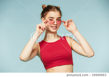 Woman standing and very cute looking at camera on Woman standing and very cute looking at camera on 38980663