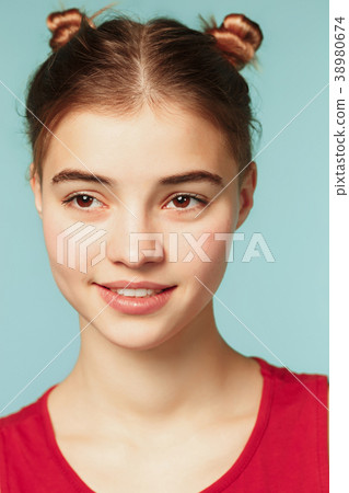 Woman smiling with perfect smile on the blue 38980674
