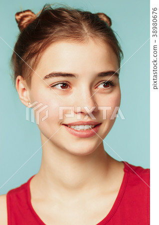 Woman smiling with perfect smile on the blue Woman smiling with perfect smile on the blue 38980676