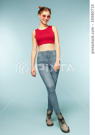 Woman smiling with perfect smile on the blue 38980718