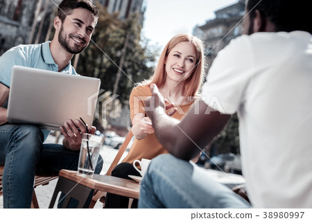 Enthusiastic business people working outdoors 38980997