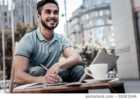 Excited bearded man generating ideas outdoors Excited bearded man generating ideas outdoors 38981046