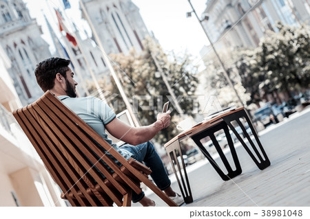 Confident gentleman working outdoors alone 38981048