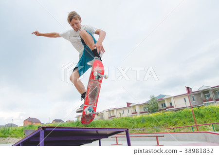 Young skateboarder in a jump Young skateboarder in a jump 38981832