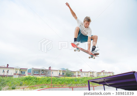 Young skateboarder in a jump 38981839
