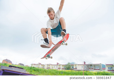 Young skateboarder in a jump Young skateboarder in a jump 38981847