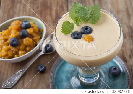 Smoothies with cloudberries and a blueberry 38982736