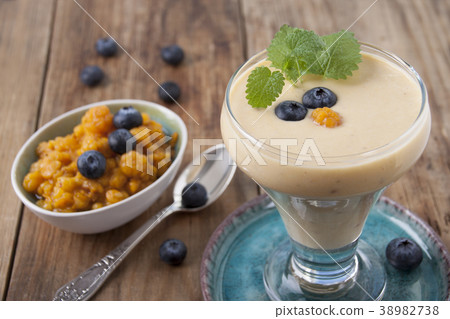 Smoothies with cloudberries  and a blueberry 38982738