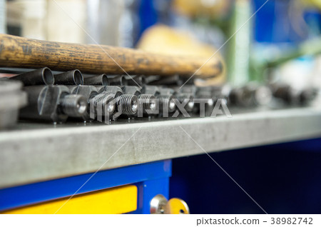 Old diesel injectors lie on the table in the fuel Old diesel injectors lie on the table in the fuel 38982742