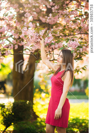 Beautiful girl posing to the photographer against 38983758
