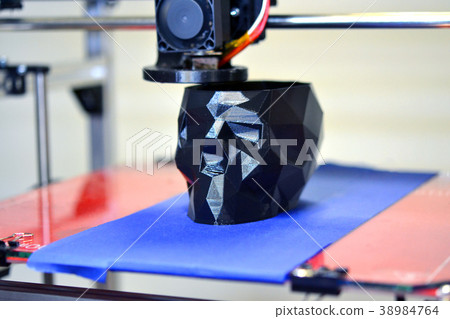 3D printer printing a model in the form of black 38984764