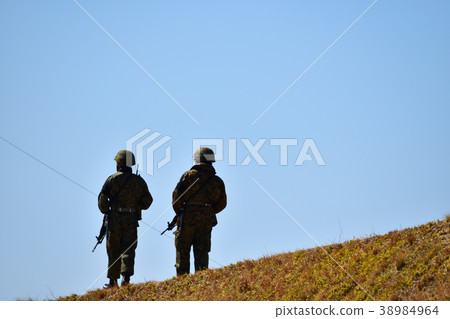 Two soldiers patrolling 38984964