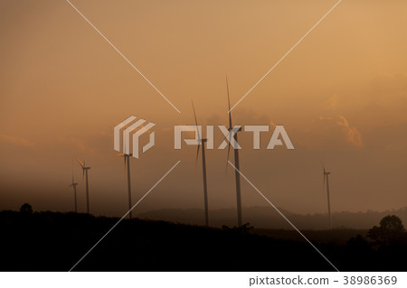 Wind turbine farm of silhouette at sunset. Wind turbine farm of silhouette at sunset. 38986369