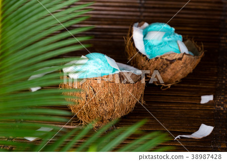 Blue ice cream in coconut bowl. Blue ice cream in coconut bowl. 38987428