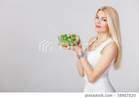 woman in white dress with fresh salad woman in white dress with fresh salad 38987820
