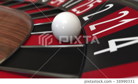 Casino roulette wheel ball hits 21 twenty-one red 38990331