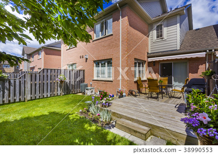 Backyard garden of custom built luxury house in 38990553