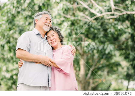 Happy senior Asian couple holding each other Happy senior Asian couple holding each other 38991075