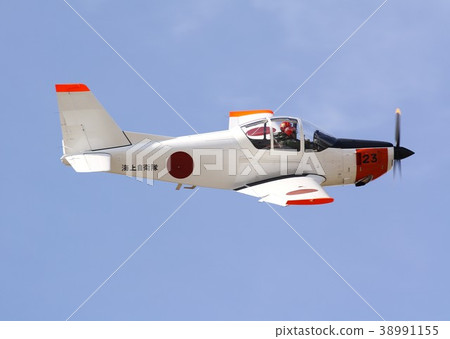 Japan Self-Defense Force T-5 domestic primary training aircraft flying acrobat against a clear autumn sky at an air show at the base of Ogetsu 38991155
